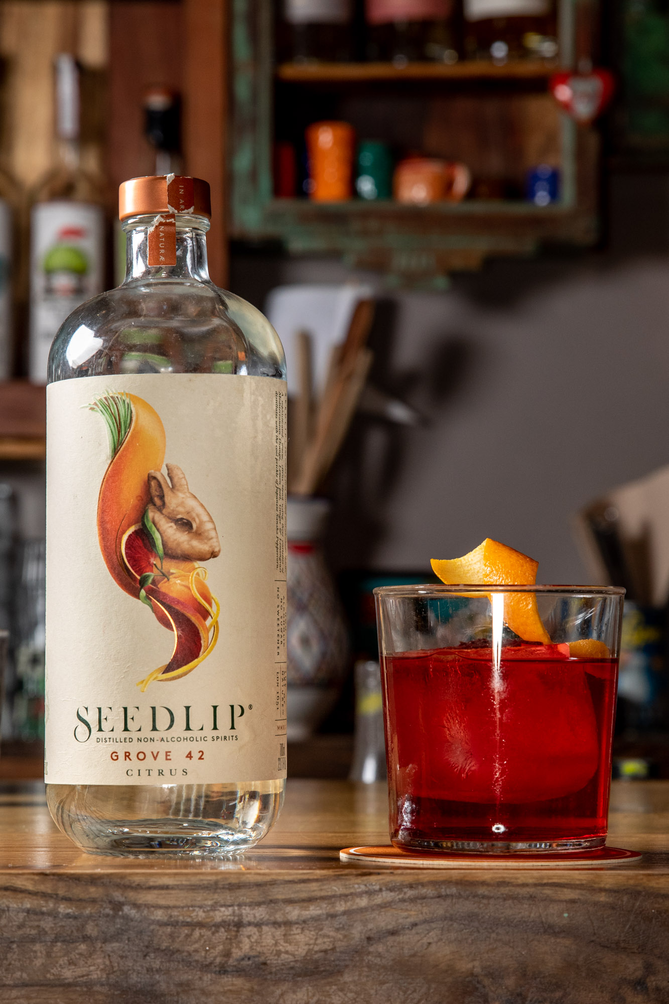 Moody cocktail sitting on top of a bar