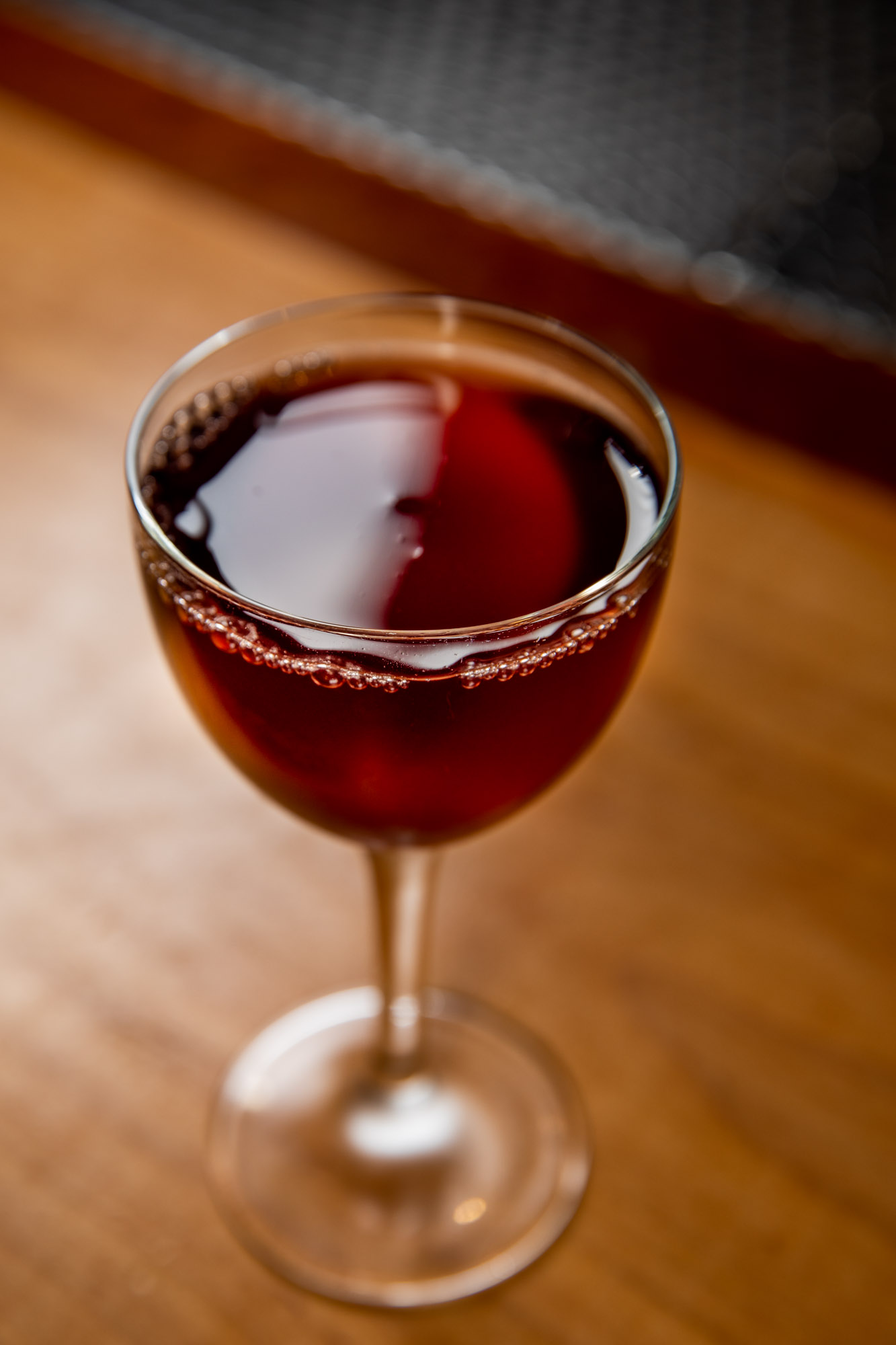A cocktail sitting on a bartop